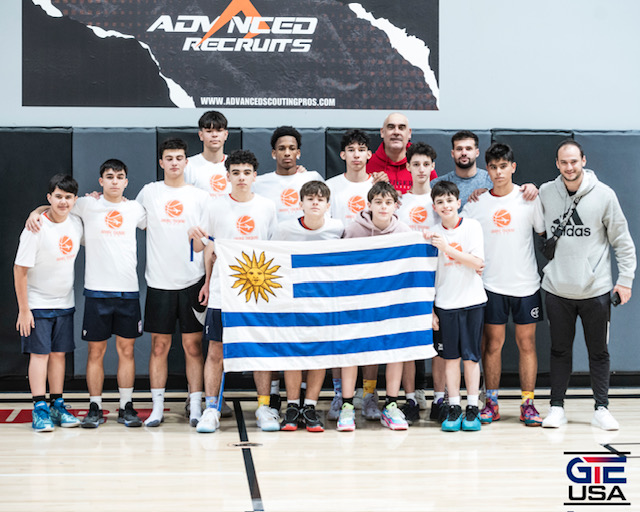 Team Photo with Coach holding Uruguay flag 